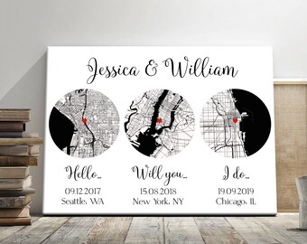 May include: A black and white map print with three circles showing the cities of Seattle, New York, and Chicago. The text "Jessica & William" is at the top of the print. The dates "09.12.2017", "15.08.2018", and "19.09.2019" are below the circles, along with the city names.