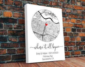 May include: A black and white map print with a red heart marking a location. The text reads "where it all began" with the names Emily & Adam, the date 02/14/2020, McKinley Park, and Sacramento, CA.