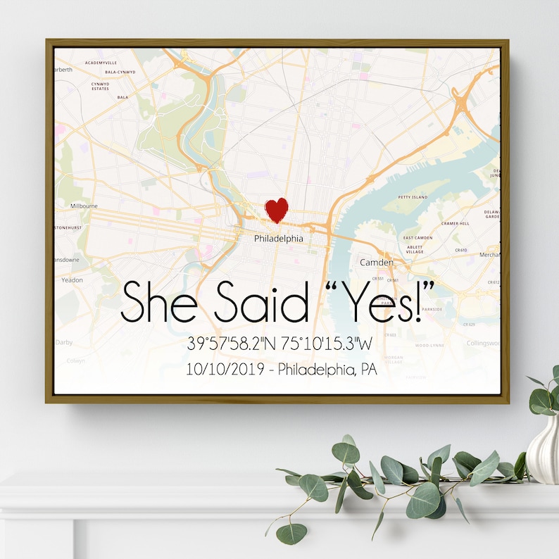 May include: A map of Philadelphia, Pennsylvania with a red heart marking the location of a proposal. The text "She Said "Yes!" 39&deg;57'58.2"N 75&deg;10'15.3"W 10/10/2019 - Philadelphia, PA" is printed below the map.