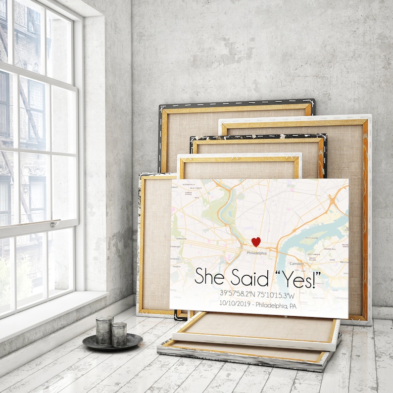 May include: A white canvas print with a map of Philadelphia, Pennsylvania. A red heart is placed on the map with the text "She Said "Yes!" 39'57'58.2"N 75&deg;10'15.3"W 10/10/2019 - Philadelphia, PA".