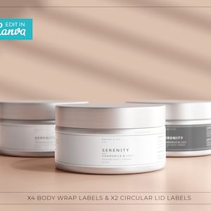 May include: Three silver jars with white labels. The centre jar has the text "BRAND & CO" and "SERENITY CHAMOMILE & LILY VEGAN BODY CREAM 8.5oz" on the label. The jars are on a light brown surface.
