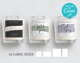 May include: Three candle labels with black borders and white backgrounds. The labels feature hand-drawn brushstrokes in different colors and the text "The Candle Company" with a scent name below. The scents are "Autumn", "Wild Grass", and "Earl Grey". Each label also includes the text "20 Hours Light" and "150g".