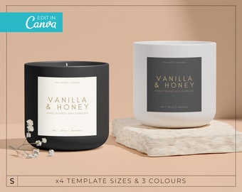 May include: Two black and white candle jars with labels that read "the candle company" and "Vanilla & Honey" in gold lettering. The labels also say "Hand Poured Soy Candles".