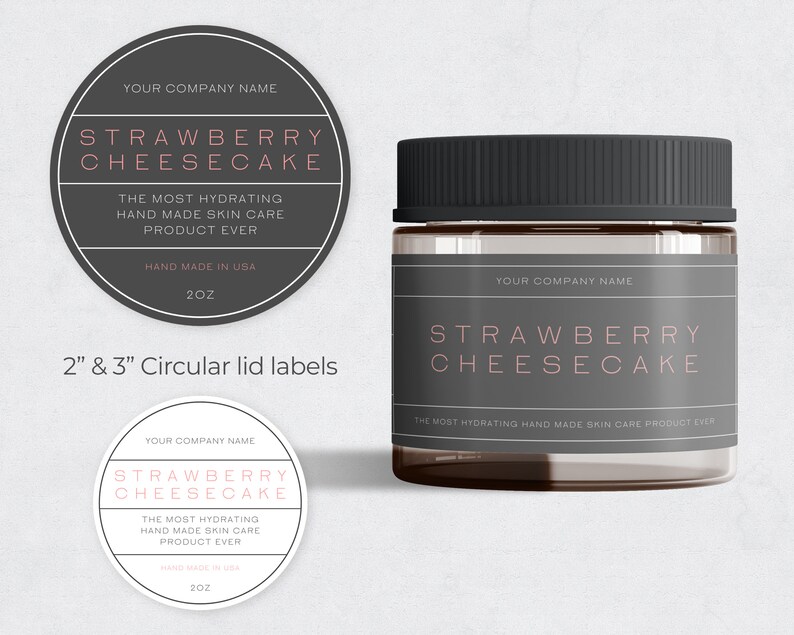 May include: Two circular labels with black borders and white backgrounds. The labels feature the text "YOUR COMPANY NAME", "STRAWBERRY CHEESECAKE", "THE MOST HYDRATING HAND MADE SKIN CARE PRODUCT EVER", "HAND MADE IN USA", and "2OZ". The labels are for a 2-inch and 3-inch jar lid. A glass jar with a black lid and a label that reads "YOUR COMPANY NAME", "STRAWBERRY CHEESECAKE", and "THE MOST HYDRATING HAND MADE SKIN CARE PRODUCT EVER".