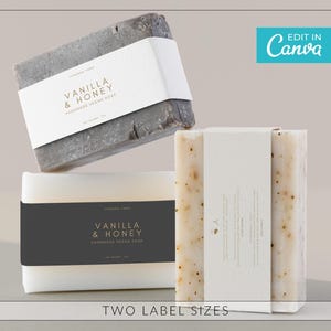 May include: Three bars of handmade vegan soap with labels that read "Vanilla & Honey." The soaps are various colors, including grey and off-white. The image also includes the text "Edit in Canva" and "Two Label Sizes."