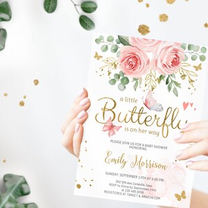 May include: A pink and gold baby shower invitation with a floral design and the text "a little Butterfly is on her way". The invitation is for Emily Morrison and includes the date, time, and location of the shower. RSVP information and registry details are also included.