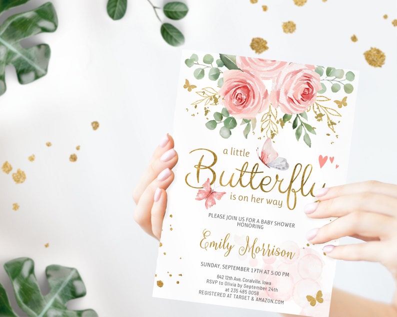 May include: A pink and gold baby shower invitation with a floral design and the text "a little Butterfly is on her way". The invitation is for Emily Morrison and includes the date, time, and location of the shower. RSVP information and registry details are also included.
