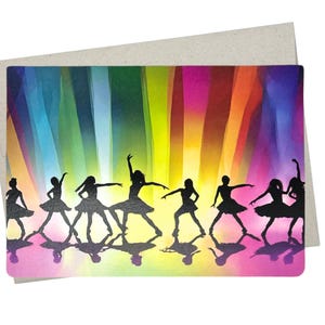 May include: Silhouettes of dancers in black against a colorful background of vertical stripes in shades of blue, green, yellow, orange, pink, and purple. The dancers are in a line, facing forward, with their arms outstretched. Their reflections are visible on the floor.