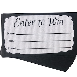 May include: Black and white entry form with the text "Enter to Win" at the top. The form has lines for a name, email, and phone number.