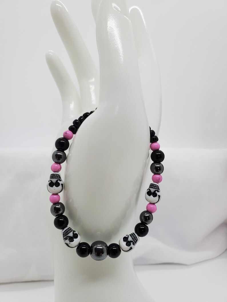black Jasper Hematite skull beads orchid Magnesite and seed beads stretch bracelet.