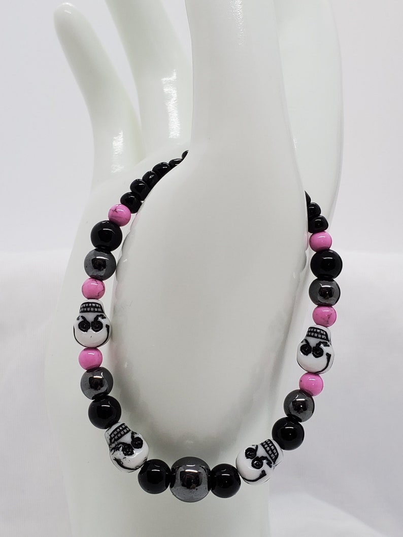 black Jasper Hematite skull beads orchid Magnesite and seed beads stretch bracelet.