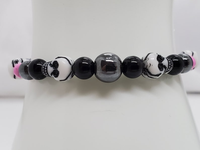 black Jasper Hematite skull beads orchid Magnesite and seed beads stretch bracelet.