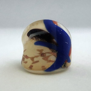 Flat ring in Murano glass, dominant ivory color and various colors with 24 ct gold glitter. Unique piece!