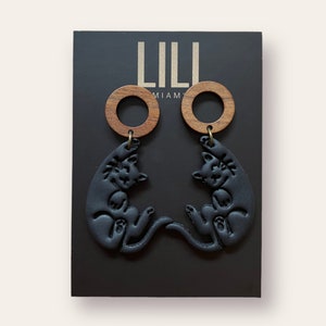 Halloween earrings with a cat in black and orange, made from polymer clay