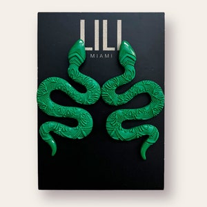 Unique emerald green snake earrings made from polymer clay