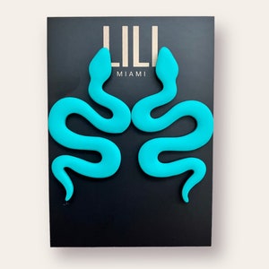 Turquoise snake earrings made from polymer clay