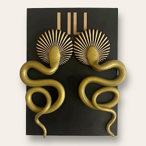 Black and gold snake stud earrings made from polymer clay