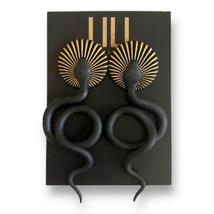 Black and gold snake stud earrings made from polymer clay