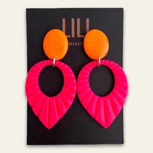 Neon pink and neon orange Art Deco drop earrings made from polymer clay
