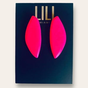 Hot pink solid color organic shape studs made from polymer clay