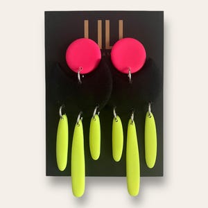 Neon pink, neon yellow and black, moon shape dangle earrings handmade from polymer clay
