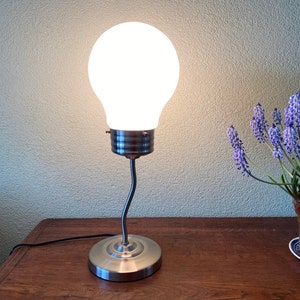 Table lamp in the shape of a light bulb from the factory: trio Leuchten