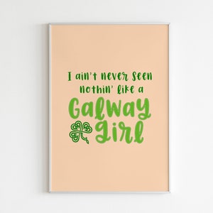 May include: A peach-colored printable poster with the text "I ain't never seen nothin' like a Galway Girl" in green cursive font. A green four-leaf clover is to the left of the word "Girl".