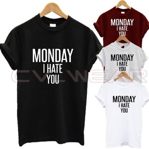 May include: Four t-shirts in different colors with the text "MONDAY I HATE YOU" printed on the front.
