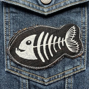 Fish skeleton denim punk patch Upcycled bone art for post-apocalyptic apparel