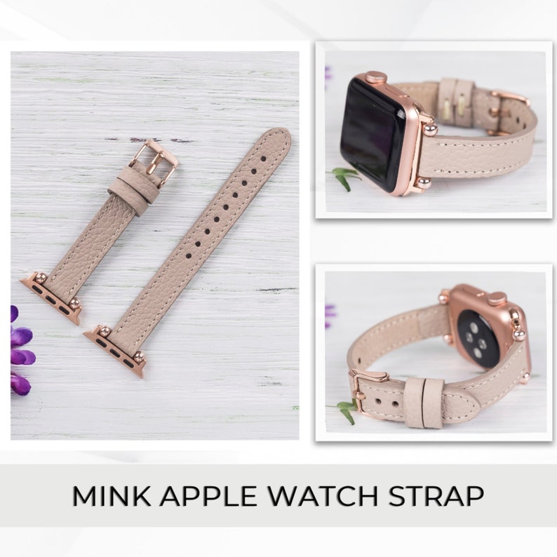 May include: A light beige leather Apple Watch band with rose gold hardware. The band is shown on a light wood background.