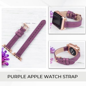 May include: Purple leather Apple Watch strap with rose gold hardware. The strap is shown on a white wooden surface.