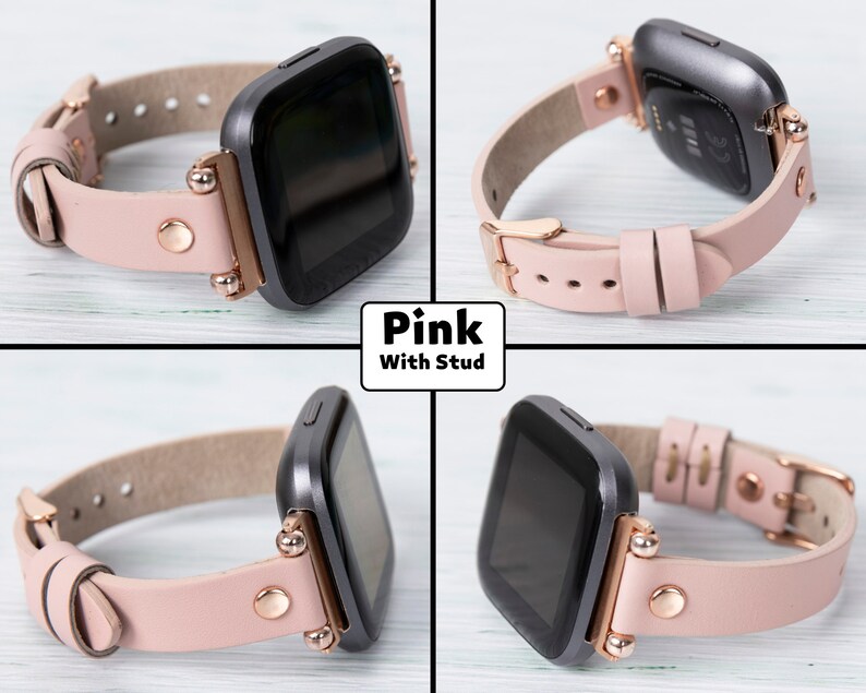 May include: Pink leather watch band with rose gold accents and studs. The band is compatible with Fitbit Versa smartwatches.