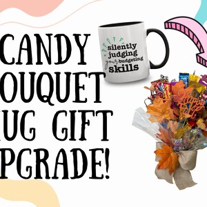 May include: A white mug with a black handle and rim, featuring the text "silently judging your budgeting skills." A candy bouquet with fall-themed leaves and a bow is also shown. The image includes the text "CANDY BOUQUET MUG GIFT UPGRADE!"