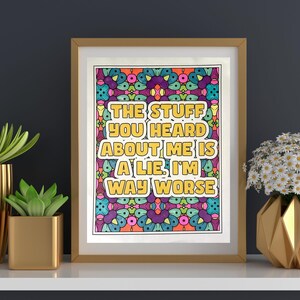 May include: A framed print with a colourful psychedelic background and the text "The stuff you heard about me is a lie. I'm way worse."