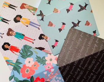 May include: Four different patterned envelopes with the text "FABULOUS happiness fearless forever FABULOUS" repeated on the gray envelope.