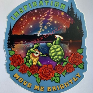 May include: A blue and green sticker with two turtles playing music in front of a starry night sky. The turtles are surrounded by red roses and the text "Inspiration Move Me Brightly" is written around the edge of the sticker.