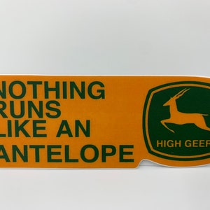 May include: Orange and green sticker with the text "NOTHING RUNS LIKE AN ANTELOPE" and a green logo with a leaping antelope and the text "HIGH GEERE".