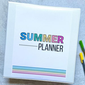 May include: White binder with the text "SUMMER PLANNER" in colorful letters. The binder has a colorful striped design at the bottom.