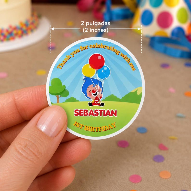 May include: A round sticker, 2 inches in diameter, featuring a cartoon clown holding balloons. The sticker has the text "Thank you for celebrating with me," "Sebastian," and "1st Birthday." The design includes a blue sky, green grass, and a small tree.