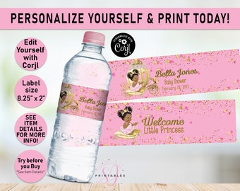 May include: A clear water bottle with a pink label featuring a baby shower design. The label includes the text "Bella Jones Baby Shower February 28, 2021" and a graphic of a baby in a carriage. The label size is 8.25" x 2".