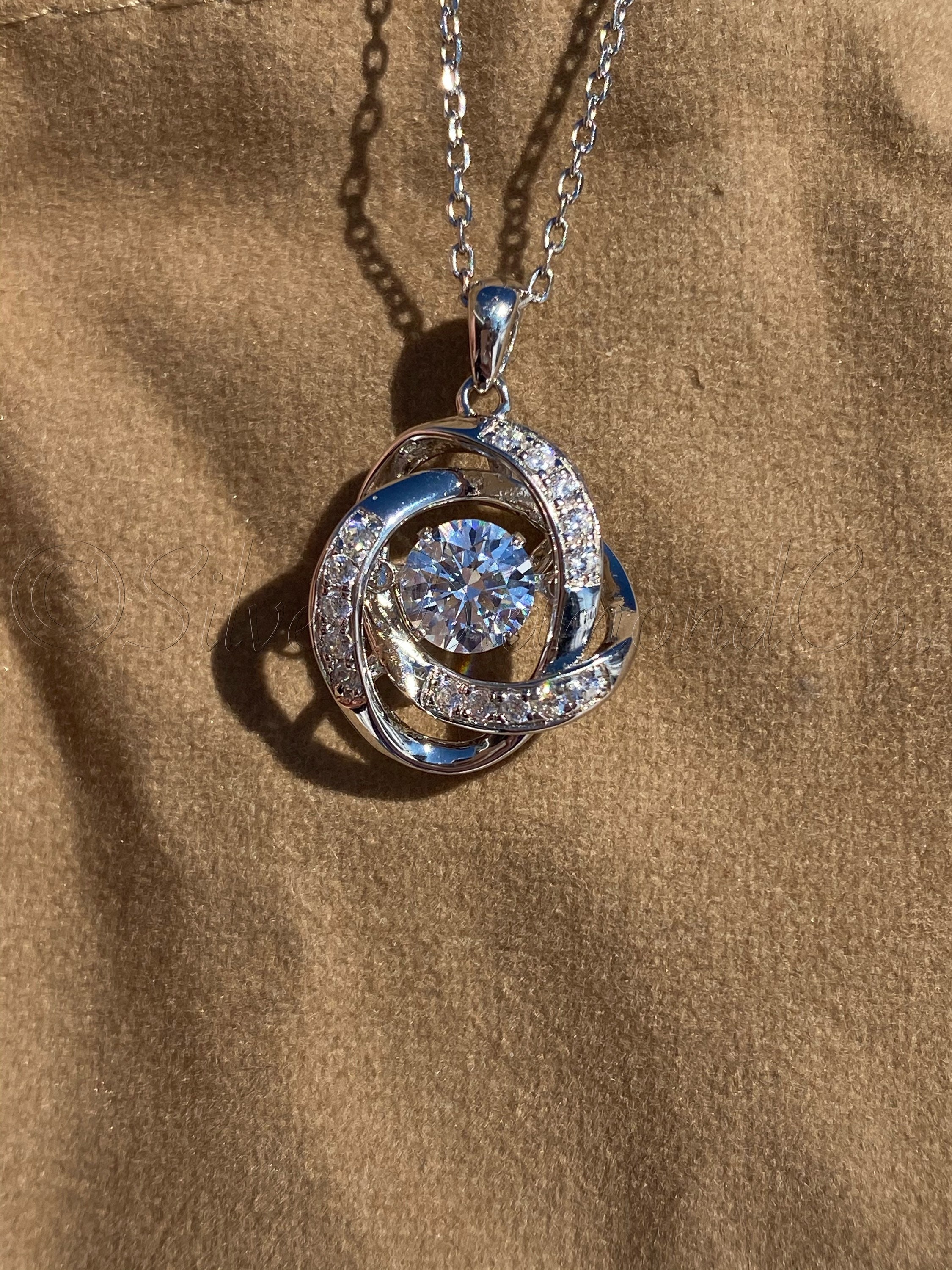 Necklace with moving stone deals