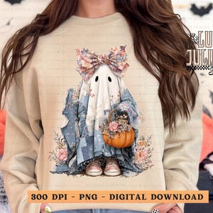 May include: A beige sweatshirt featuring a whimsical ghost design. The ghost wears a patchwork quilt outfit, a floral bow, and holds a pumpkin basket. The design includes pink flowers and the text "300 DPI - PNG - DIGITAL DOWNLOAD".
