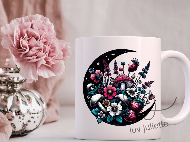 May include: White ceramic mug with a crescent moon design featuring a colorful bouquet of flowers, mushrooms, and strawberries. The text "luv juliette" is printed on the bottom of the mug.