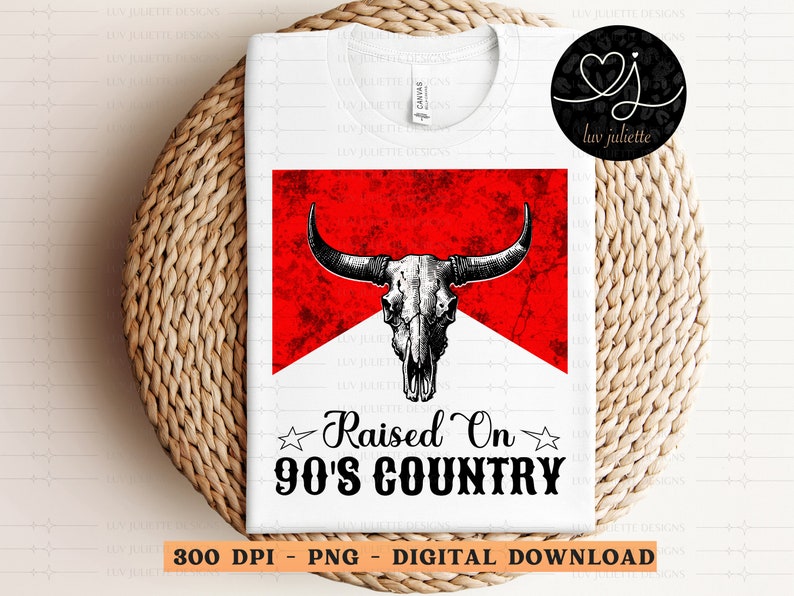 May include: A white t-shirt with a red and white graphic of a bull skull with the text "Raised On 90's Country" printed on it.