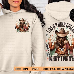 May include: Cream-colored hoodie with a graphic of a woman in a cowboy hat making a rock-and-roll hand gesture. The back of the hoodie has the text "I DO A THING CALLED WHAT I WANT". The design includes stars, lightning bolts, and the text "300 DPI - PNG - DIGITAL DOWNLOAD".