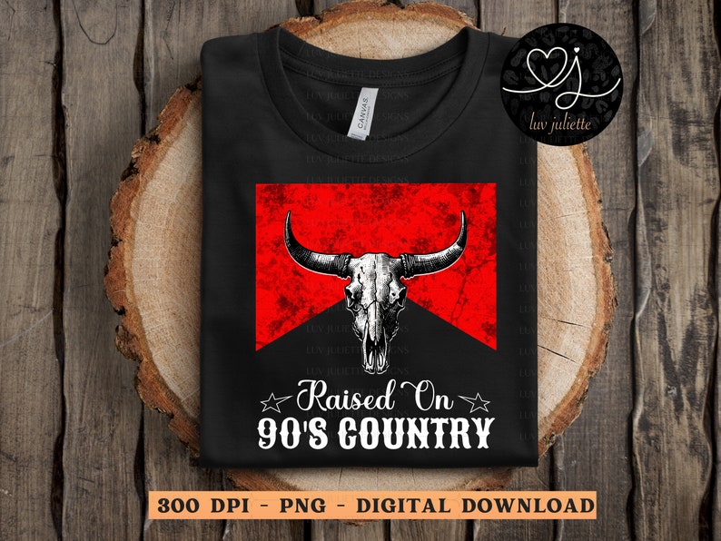 May include: A black t-shirt with a red and white graphic of a bull skull with the text "Raised On 90's Country".