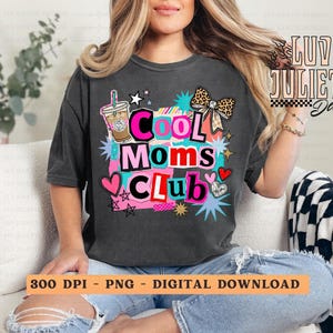 May include: Dark gray t-shirt with the text "Cool Moms Club" in a colorful, playful design. The graphic includes a coffee cup, hearts, stars, and a leopard print bow. The shirt is a digital download.