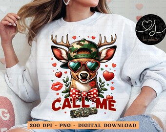 May include: White sweatshirt with a graphic of a deer wearing a camouflage hat and sunglasses. The deer is surrounded by hearts and the text "Call Me".