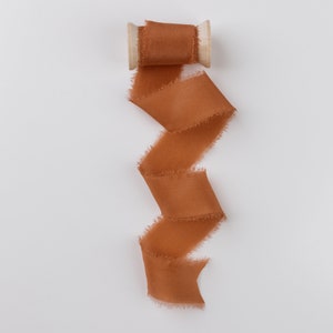 Robin Orange Frayed Edge Silk Ribbon with Wooden Spool Flat Lay Styling Ribbon