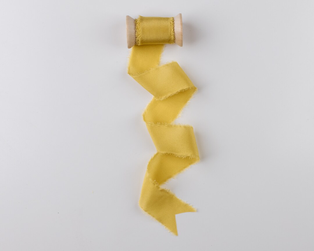 Floding Ribbon Yellow Canary Yellow Frayed Edge Silk Ribbon With Wooden Spool Flat Lay ...